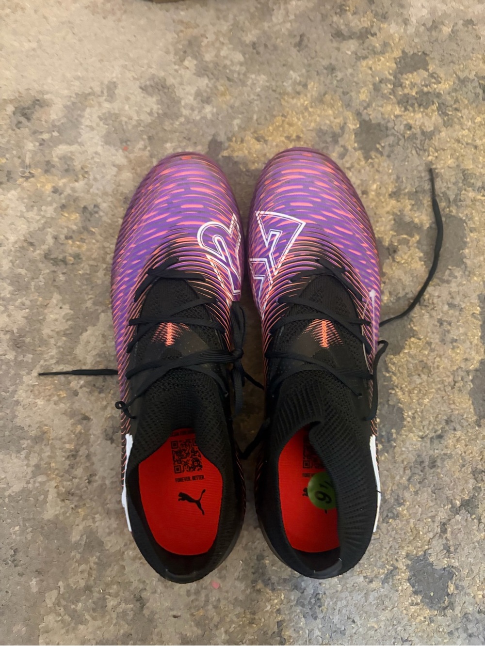 Puma Black Athletic Cleats with Coral Outsole and Purple Studs